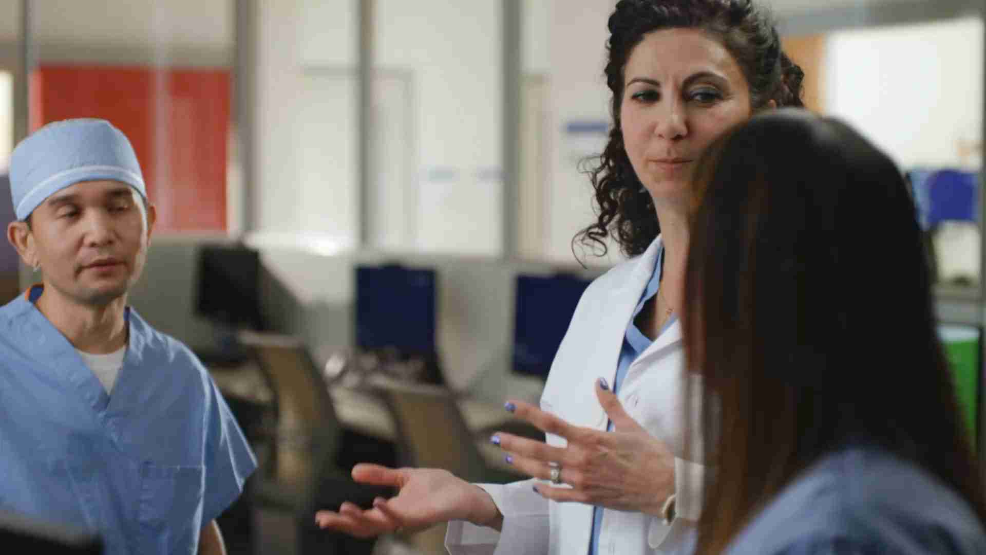A doctor talking with nurses.